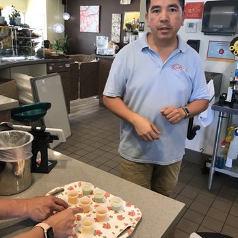 3 Blossoms Cafe - Owner Mr. Kim providing samples and explaining the healthy benefits of the teas he serves. - Bubble Tea Near Me - Westminster, California