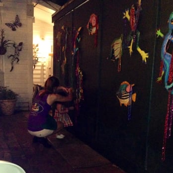Caroline's - Our waitress picking out necklaces with our daughter. - American Near Me - Key West, Florida Caroline's - Our waitress picking out necklaces with our daughter. - American Near Me - Key West, Florida
