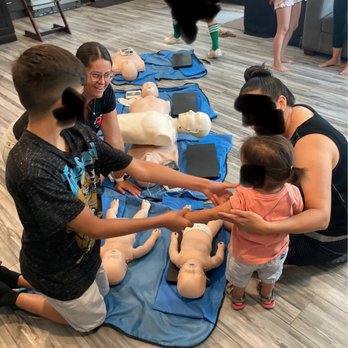Oc Cpr - Showing how to feel a child's pulse. - CPR Classes Near Me - Fountain valley, California Oc Cpr - Showing how to feel a child's pulse. - CPR Classes Near Me - Fountain valley, California