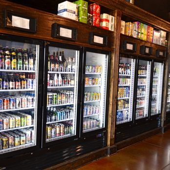 Firewater Liquor - a row of beer coolers - Beer, Wine & Spirits Near Me - Waco, Texas Firewater Liquor - a row of beer coolers - Beer, Wine & Spirits Near Me - Waco, Texas