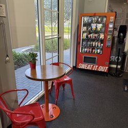 Vending machine + tables to relax and snack before workout.
