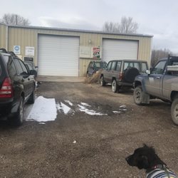D C's Automotive - The last 2 garage doors on the green and tan building
