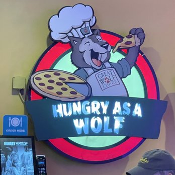 Hungry As a Wolf - a man eating pizza - Pizza Near Me - Fitchburg, Massachusetts Hungry As a Wolf - a man eating pizza - Pizza Near Me - Fitchburg, Massachusetts