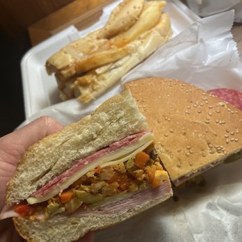 Verti Marte - "Spicy" Muffaletta "The Bam-Bam" and French Fry Poboy Sandwich - Delis Near Me - New Orleans, Louisiana