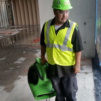 SERVPRO - SERVPRO of East Central Austin: Crew member, Armando, is looking for the ideal place to set up air movers in downtown Austin. - Damage Restoration Near Me - Austin, Texas SERVPRO - SERVPRO of East Central Austin: Crew member, Armando, is looking for the ideal place to set up air movers in downtown Austin. - Damage Restoration Near Me - Austin, Texas