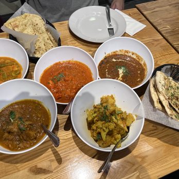 Monsoon Indian Cuisine - A bunch of delicious entrees (rice not shown). - Indian Near Me - Indio, California Monsoon Indian Cuisine - A bunch of delicious entrees (rice not shown). - Indian Near Me - Indio, California