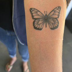 White Lotus Tattoo - Monarch butterfly done by Osh