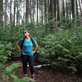 Calaveras Big Trees State Park - This woman is almost as tall as these so-called "big" trees. - Parks Near Me - Arnold, California Calaveras Big Trees State Park - This woman is almost as tall as these so-called "big" trees. - Parks Near Me - Arnold, California