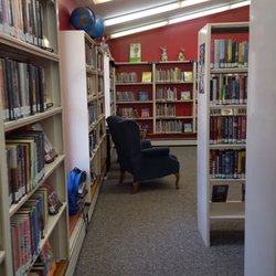 Onekama Library - Looking along the back wall to the kids area