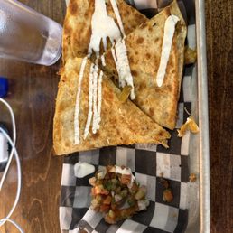 Chicken Tinga quesadilla minus one slice so good Chicken Tinga quesadilla minus one slice so good
