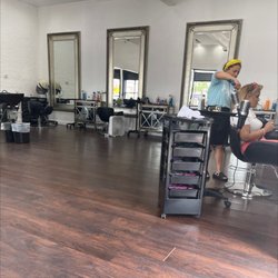 Ooh La La Hair Salon & Barbershop - Ooh La la beauty Salon, the owner taking care of a customer.