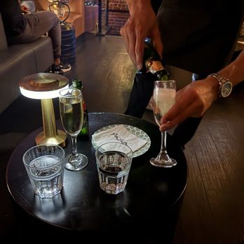 Pasha Sf - Waiter pouring champagne - Mediterranean Near Me - San Francisco, California Pasha Sf - Waiter pouring champagne - Mediterranean Near Me - San Francisco, California