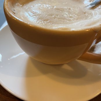 Noosh Nosh - Delicious caramel latte in a sunny yellow mug - American Near Me - Louisville, Kentucky
