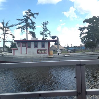 Cajun Critters Swamp Tour - One of the beautiful boats docked on the water. - Tours Near Me - Westwego, Louisiana