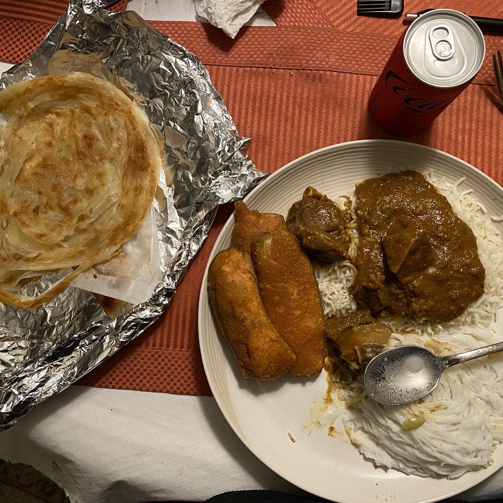 Cap Hill Kitchens - Parotta, Curried goat with rice, Idiyappam Malagai bajji, batter fried chickpea fritter - Food Court Near Me - Seattle, Washington Cap Hill Kitchens - Parotta, Curried goat with rice, Idiyappam Malagai bajji, batter fried chickpea fritter - Food Court Near Me - Seattle, Washington