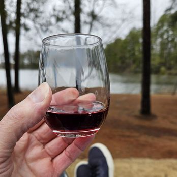 Jolene Family Winery - a hand holding a glass of wine - Wine Tasting Room Near Me - Quinton, Virginia Jolene Family Winery - a hand holding a glass of wine - Wine Tasting Room Near Me - Quinton, Virginia