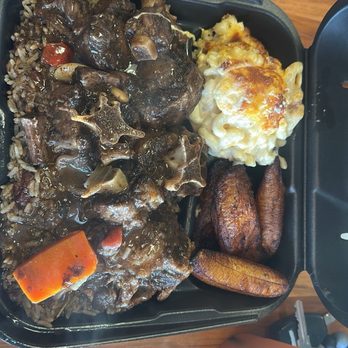 Mangos Cafe And Specialty store - Caribbean Braised Oxtails Vegan pepper steak with your choice of rice and two additional sides (Mac and Cheese, Plantains) - Caribbean Near Me - Temple Terrace, Florida Mangos Cafe And Specialty store - Caribbean Braised Oxtails Vegan pepper steak with your choice of rice and two additional sides (Mac and Cheese, Plantains) - Caribbean Near Me - Temple Terrace, Florida