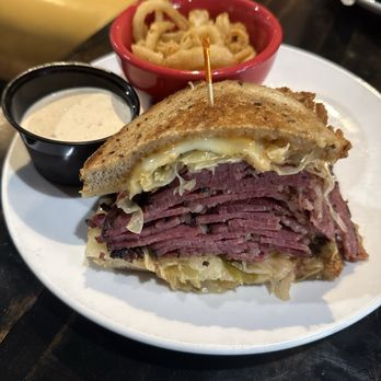 Chompie's Restaurant, Deli, and Bakery - Pastrami Rueben on Rye with onion strings - Breakfast & Brunch Near Me - Phoenix, Arizona Chompie's Restaurant, Deli, and Bakery - Pastrami Rueben on Rye with onion strings - Breakfast & Brunch Near Me - Phoenix, Arizona