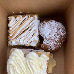 Amandine Bakery and Cafe - Lemon bar, blueberry-lemon mascarpone cake and salted caramel puff missing a very generous bite! (Sorry, it was that darned good)