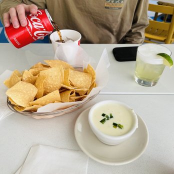 Taqueria Del Sol - a bowl of chips and a drink - Tex-Mex Near Me - Atlanta, Georgia Taqueria Del Sol - a bowl of chips and a drink - Tex-Mex Near Me - Atlanta, Georgia