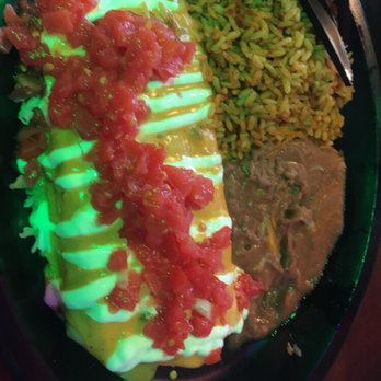 Tijuana Flats - Steak chimichanga wet with queso and a side of rice and refried beans - Mexican Near Me - Casselberry, Florida