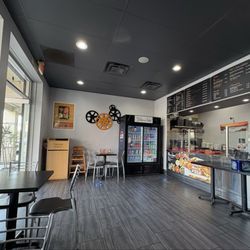 Bollywood Zaika - Restaurant interior, service counter, drink cooler, and tables