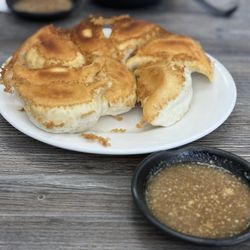 Highly recommend "pan fried pork with leeks bun".  Served with potent soy-raw garlic sauce.   Delicious