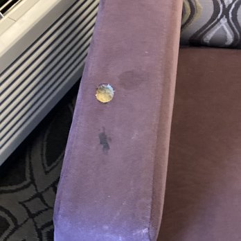 Crowne Plaza Saddle Brook - Cigarette burn hole in arm chair - Hotels Near Me - Saddle Brook, New Jersey
