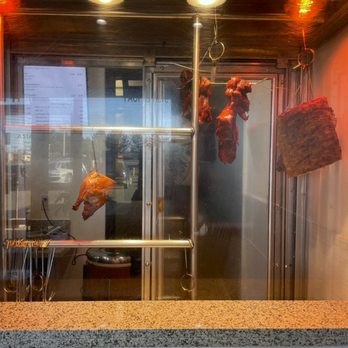 Asian Spice - meat hanging from a rack in a restaurant - Thai Near Me - Littleton, Colorado Asian Spice - meat hanging from a rack in a restaurant - Thai Near Me - Littleton, Colorado