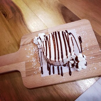 Double D's Cheesecake & Coffee House - chocolate drizzle on a wooden cutting board - Desserts Near Me - Winnipeg, Manitoba Double D's Cheesecake & Coffee House - chocolate drizzle on a wooden cutting board - Desserts Near Me - Winnipeg, Manitoba