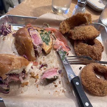 Tipsy Cow Burger Bar - Half eaten Big Eye! Love the onion rings! - Burgers Near Me - Issaquah, Washington