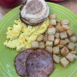 2 egg scrambled breakfast with potatoes and Canadian ham. 2 egg scrambled breakfast with potatoes and Canadian ham.