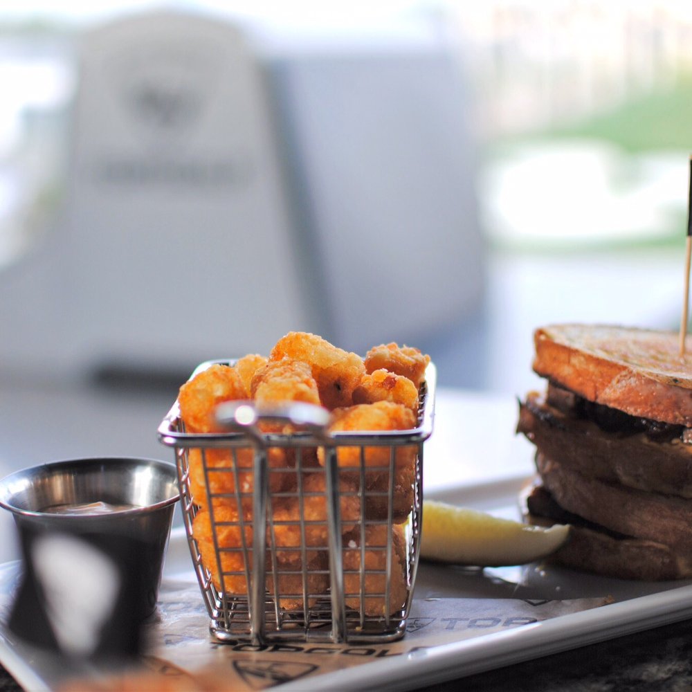 Topgolf - Brisket grilled cheese with tater tots - Sports Bars Near Me - Midvale, Utah Topgolf - Brisket grilled cheese with tater tots - Sports Bars Near Me - Midvale, Utah