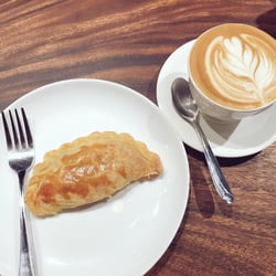 Craft Coffee Revolution - Chicken empanada with a cappuccino