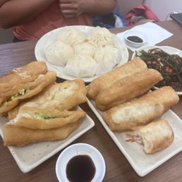Pork buns, original fried dough and fried dough with bread. Seaweed salad with peanuts. Pork buns, original fried dough and fried dough with bread. Seaweed salad with peanuts.