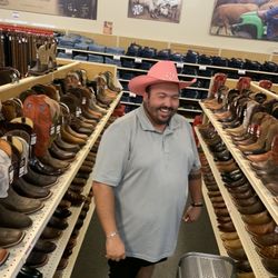 Justin Boots - If your looking for a pink tiara cowgirl hat, they got em. Kyle looking especially pretty in this ensemble, with his slippa's on!