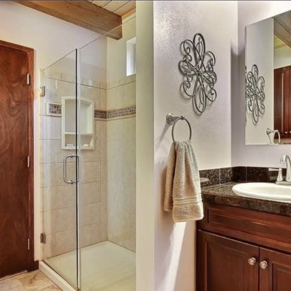 Intra Flooring - a bathroom with a sink and a shower - Flooring Near Me - Kent, Washington Intra Flooring - a bathroom with a sink and a shower - Flooring Near Me - Kent, Washington
