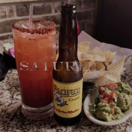 Michelada with a side of Guacamole & chips.