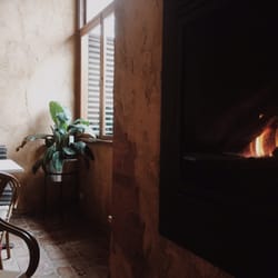 Carmine & Co - Head to the back room for some quite and warmth by the fire.
