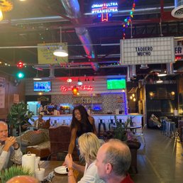 a group of people eating at a restaurant