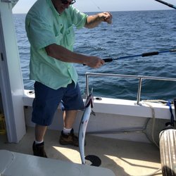 Get Hooked Fishn Charters - Getting them off the hook is tricky- best left up to the expert!