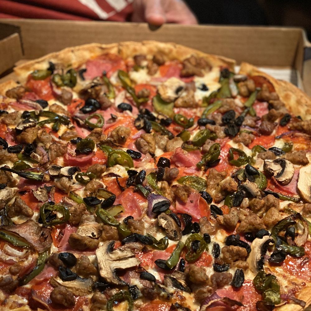 Thin and crispy Super Supreme Pizza with jalapeños Thin and crispy Super Supreme Pizza with jalapeños