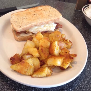 Tory's Cafe - Breakfast Sandwich w/ bacon, 2 eggs, on toasted rye. Side of home fries. - American Near Me - Clearwater, Florida Tory's Cafe - Breakfast Sandwich w/ bacon, 2 eggs, on toasted rye. Side of home fries. - American Near Me - Clearwater, Florida