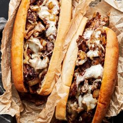 Wow Burgers & Grill - A rich, comforting sandwich, where the combination of tender beef, melted cheese, and vegetables creates a deliciously satisfying bite.