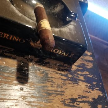 Smoking Jacket Cigar Lounge - a cigar in a cigar holder - Cigar Bars Near Me - Cedar Hill, Texas Smoking Jacket Cigar Lounge - a cigar in a cigar holder - Cigar Bars Near Me - Cedar Hill, Texas