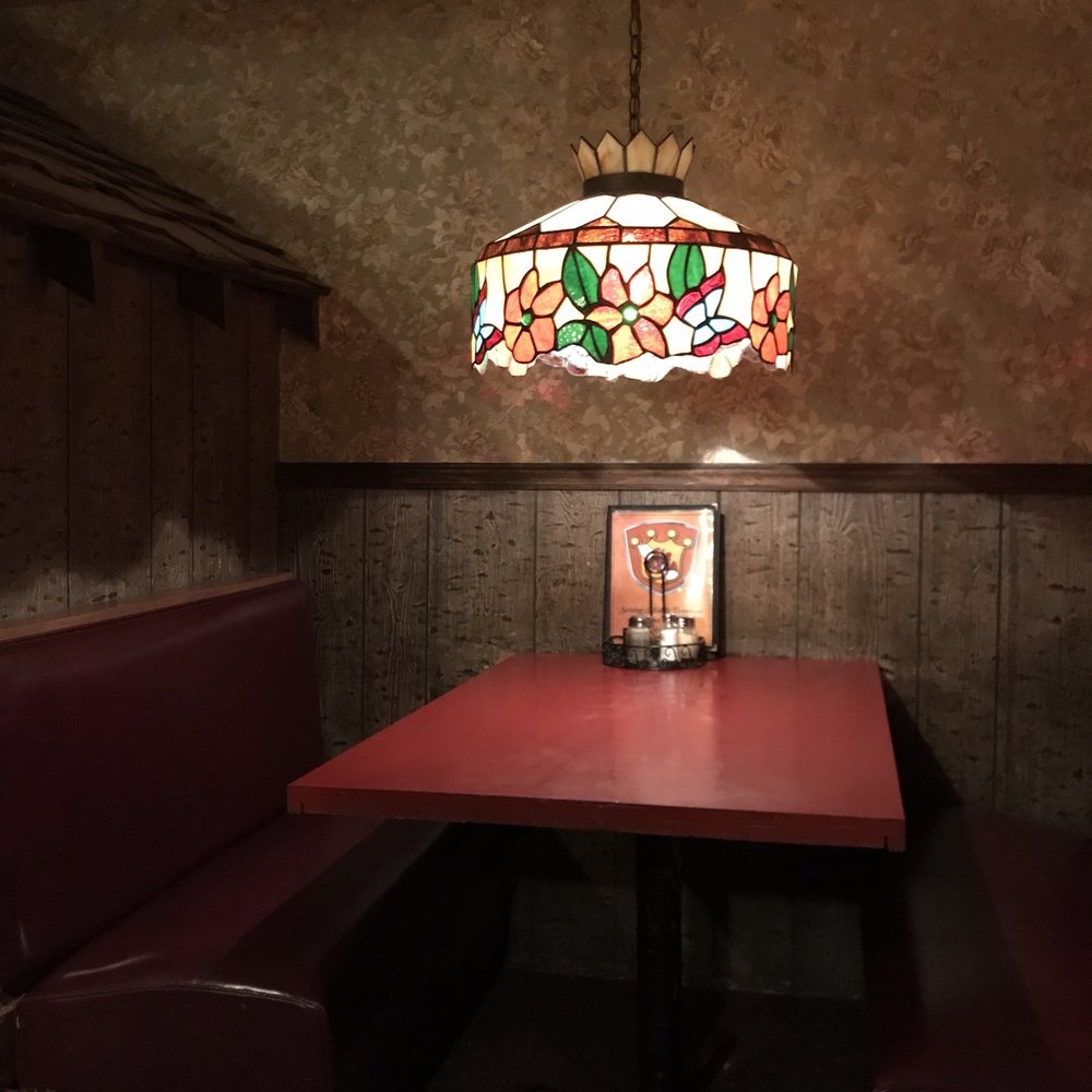 Sir Pizza - a table and booths in a restaurant - Pizza Near Me - Murfreesboro, Tennessee Sir Pizza - a table and booths in a restaurant - Pizza Near Me - Murfreesboro, Tennessee