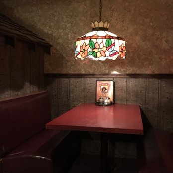Sir Pizza - a table and booths in a restaurant - Pizza Near Me - Murfreesboro, Tennessee