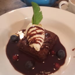 Chocolate brownie with chocolate sauce and coffee Chantilly Chocolate brownie with chocolate sauce and coffee Chantilly