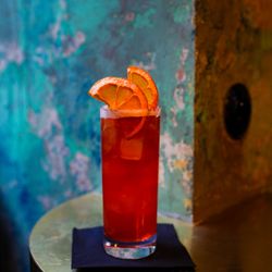 Aura - Woodford bourbon with strawberries and rooibos tea.