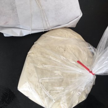 Liguria Bakery - Focaccia wrapped in paper and fresh pizza dough. $4 and I'm told is enough to make two 15 inch pies. - Bakeries Near Me - San Francisco, California